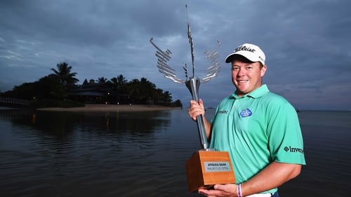 George Coetzee with the AfrAsia Bank Mauritius Open trophy