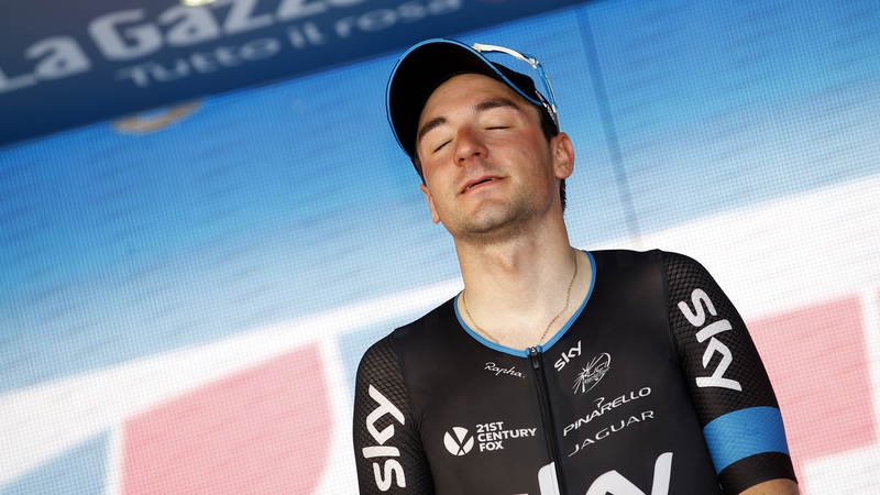 Italy's Elia Viviani celebrates his stage victory on the podium