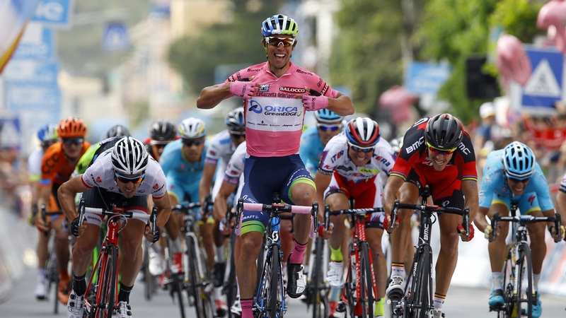 Australian Michael Matthews (C) crosses the finish line to win the 3rd stage of the 98th Giro d'Italia