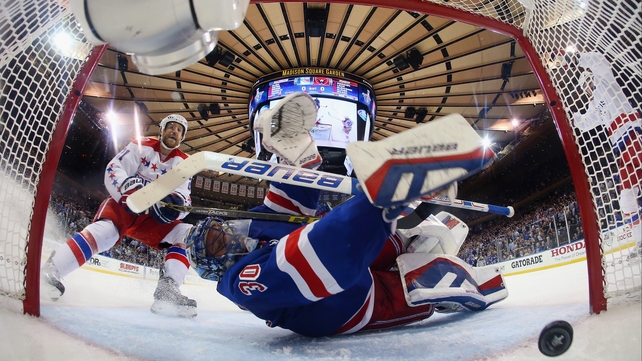 Brooks Laich of the Washington Capitals watches a shot enter the net past Henrik Lundqvist of the New York Rangers in the 2015 NHL Stanley Cup play-offs at Madison Square Garden, New York