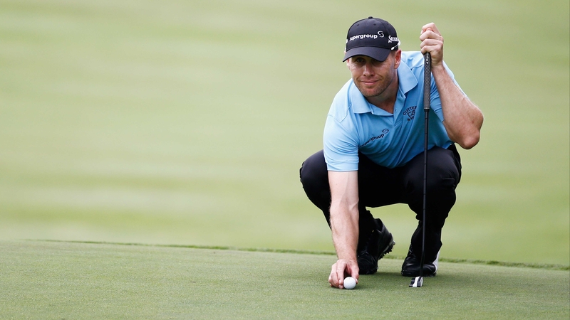 Trevor Fisher lines up his putt on the 17th