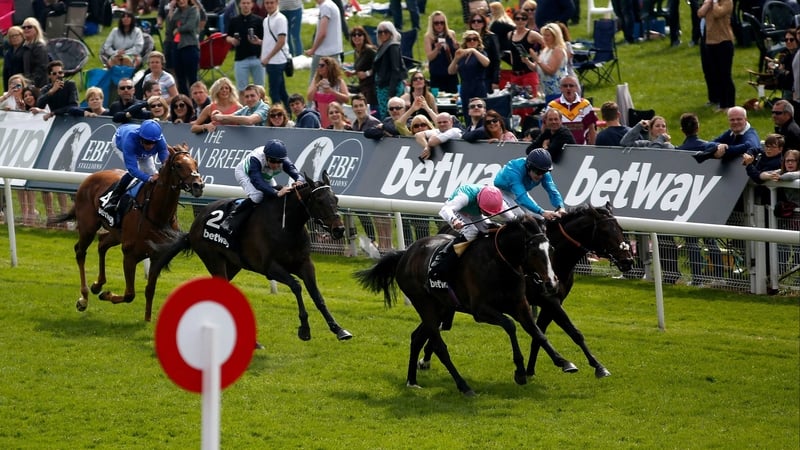 Snow Sky (near side) edges out Brown Panther on the Knavesmire