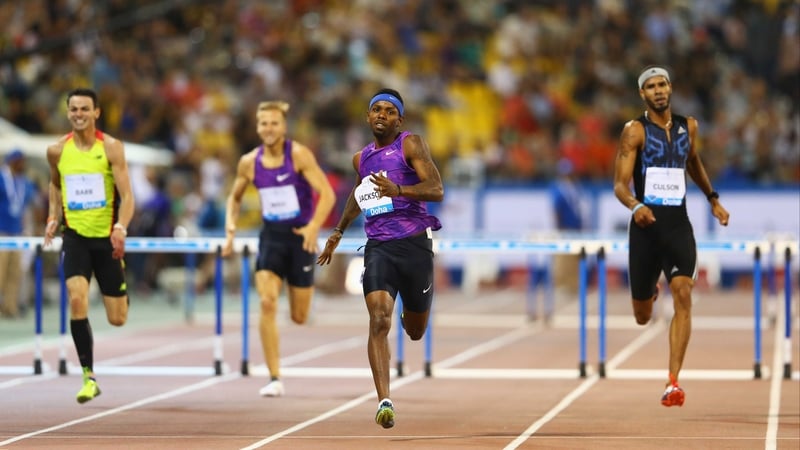 A grimacing Thomas Barr (yellow singlet) finishes with a flourish to seal third spot in Doha