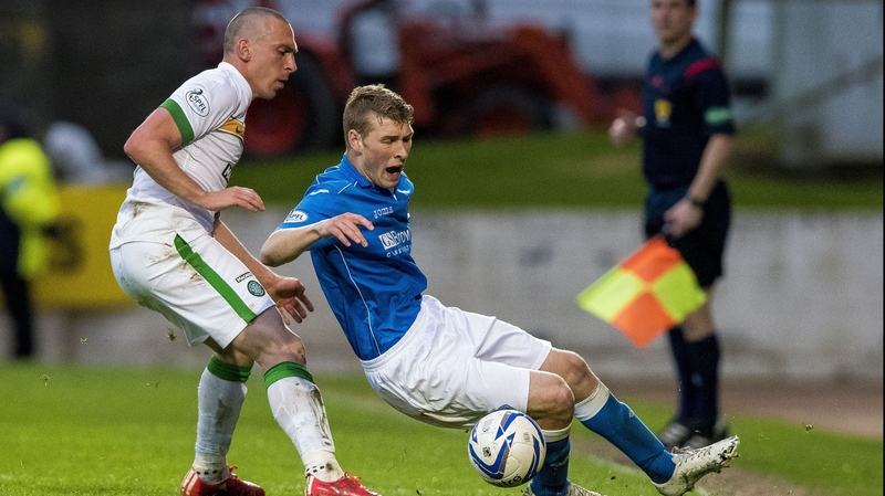 Celtic's Scott Brown (left) and St Johnstone's David Wotherspoon battle for the ball