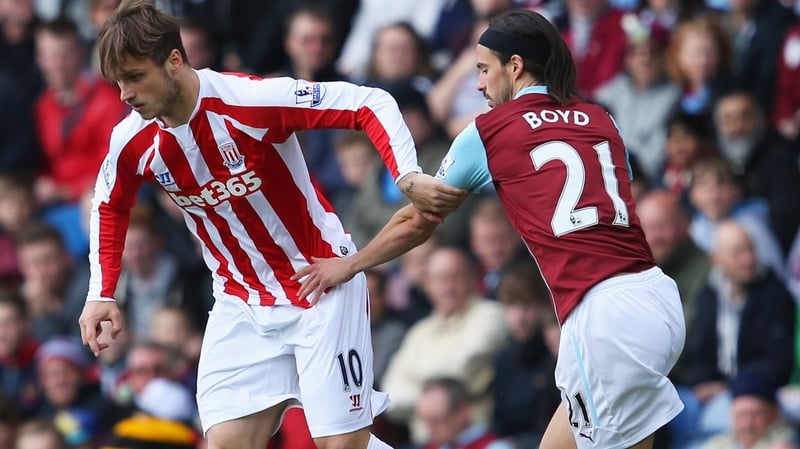 Marko Arnautovic of Stoke City and George Boyd of Burnley