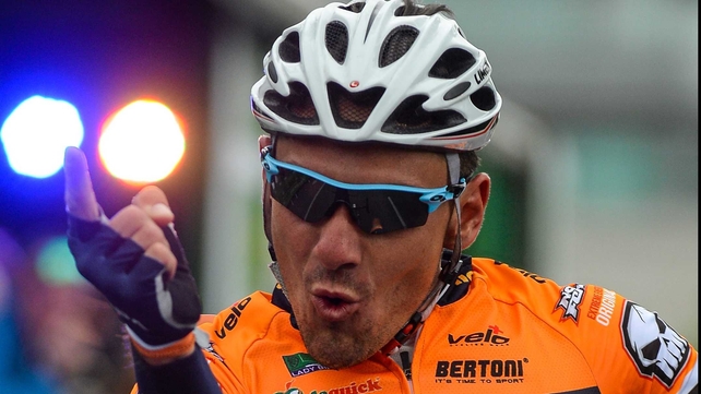 Francesco Reda celebrates after crossing the line and securing the opening stage