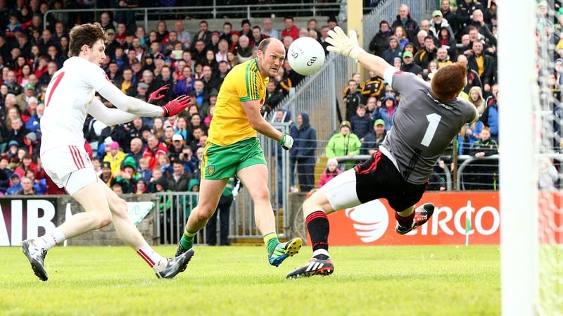 Donegal's Colm McFadden has his shot saved by goalkeeper Michael O'Neill of Tyrone