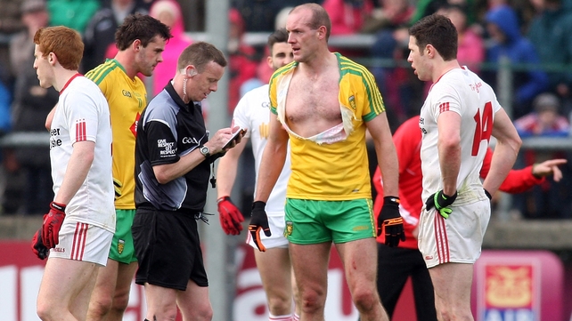 Donegal's Neil Gallagher loses his shirt - before being shown a second yellow card by Joe McQuillan