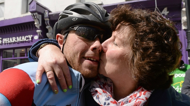 Simon Ryan (Mego RT) receives a kiss from his mother Eileen after the stage finish