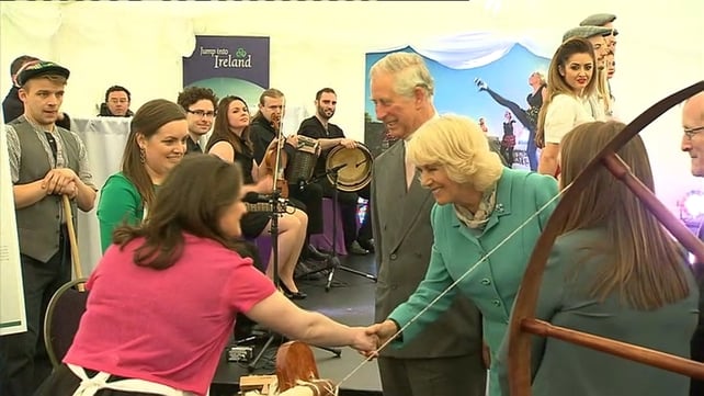 The Royal couple shake hands with people at NUI Galway
