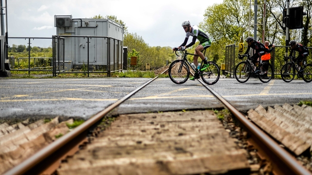 Conor Dunne (An Post Chain Reaction) crosses a rail track along the route