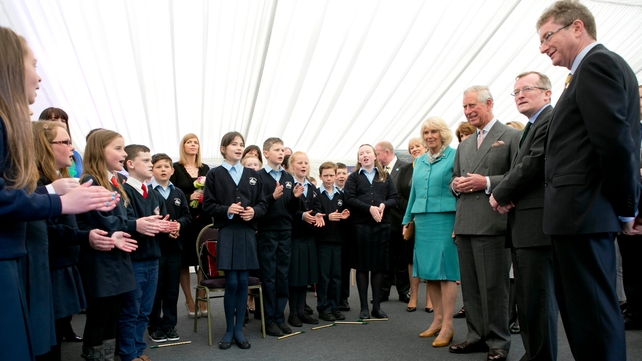 Schoolchildren perform for the Royal couple