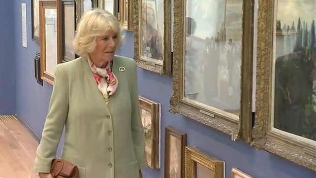 The Duchess of Cornwall admires pieces of artwork displayed in the Model Arts Centre