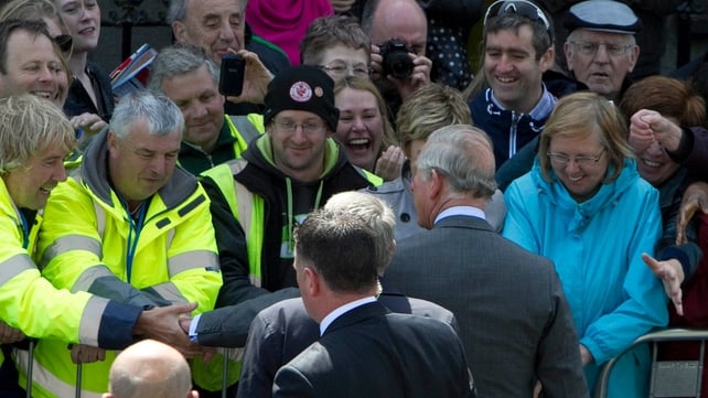 Prince Charles shakes hands with members of the public