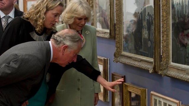 Prince Charles and his wife are given a tour of the Model Arts Centre