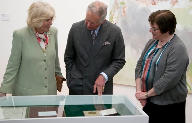 Britain's Prince Charles and his wife are shown pieces from the Niland Art Collection