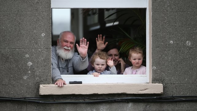 Local residents wait for the Prince of Wales and the Duchess of Cornwall to arrive