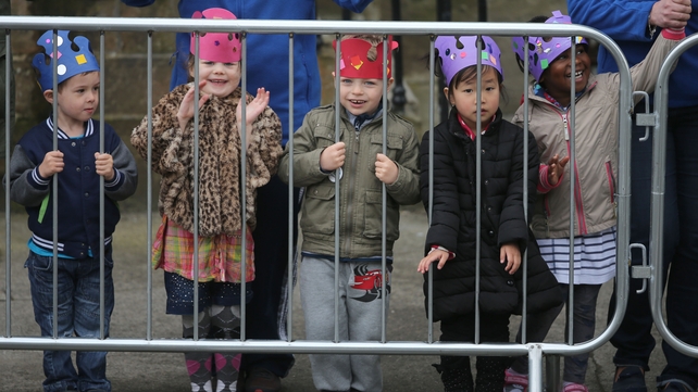 Local children wait for the Royal couple to arrive
