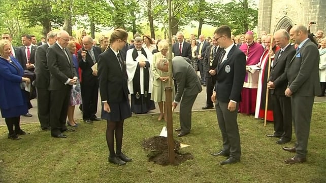 Prince Charles and his wife plant a tree outside St Columba's Church in Drumcliffe