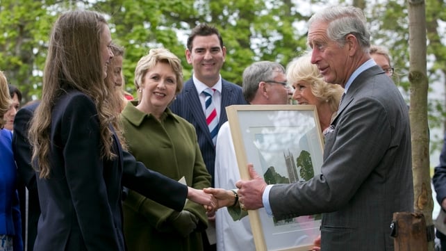 The Prince of Wales and his wife are presented with a painting in Drumcliffe