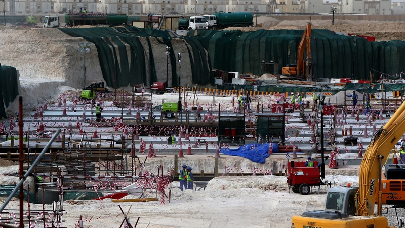 Foreign laborers work at the construction site of the al-Wakrah football stadium, one of the Qatar's 2022 World Cup stadiums