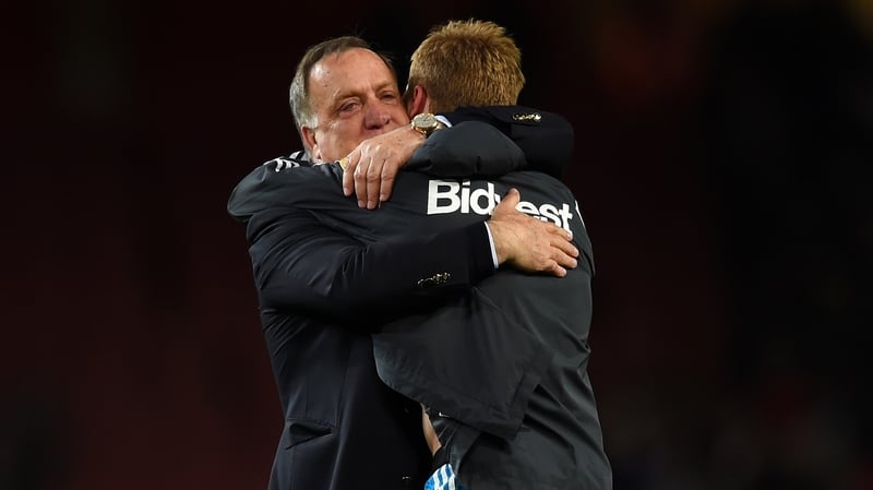 Dick Advocaat embraces Sebastian Larsson after Sunderland