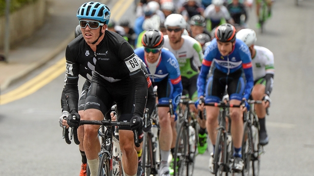 The peloton, lead by Pieter Bulling, New Zealand National Team, as it makes its way through Manorhamilton, Co. Leitrim