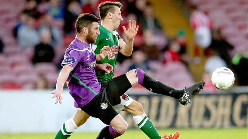 Shamrock Rovers' Gavin Brennan and Liam Miller of Cork City vie for possession