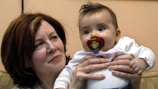 Then 55-year-old Annegret Raunigk holds her daughter Lelia in her hands at her house in Berlin, in 2005
