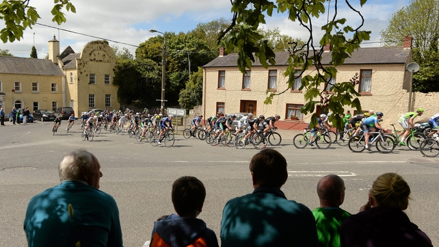 A spectator's view of the peloton through the village of Naul.