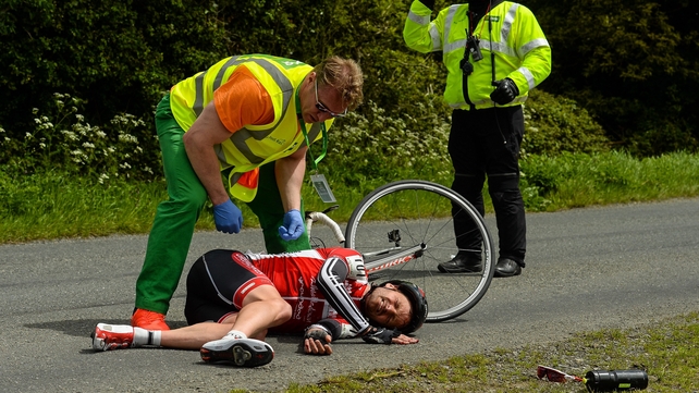 Sean Featherstone, Newry Wheelers, lies on the ground after beng involved in an accident.