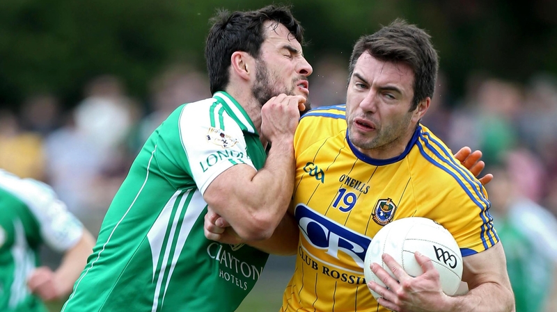 London's Martin Carroll feels the shoulder of Roscommon's Ian Kilbride
