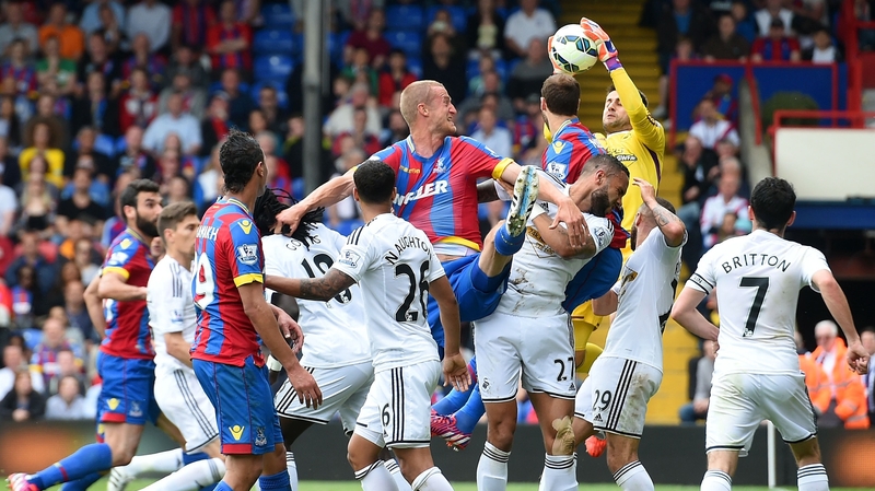 Swansea City goalkeeper Lukasz Fabianski claims the ball