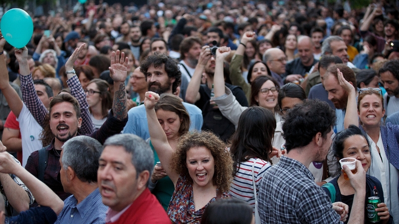 In Madrid supporters of protest grouping Ahora Madrid celebrated as the group tied with Spain's governing Popular Party