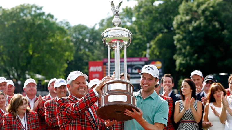 Chris Kirk poses with the Leonard trophy