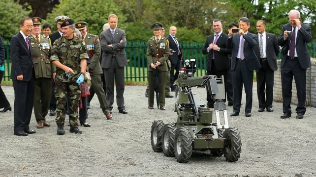 Lt Cl Lane shows Mr Ban a bomb disposal robot