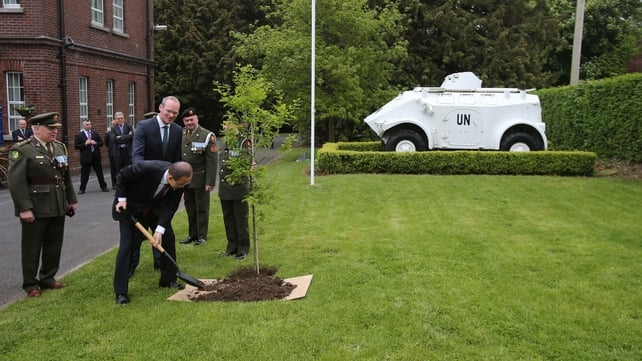 Mr Ban plants a tree at the Defence Forces Training Centre with Minister for Defence Simon Coveney