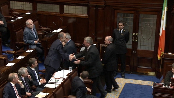 Bobby Aylward shakes hands with Micheál Martin before taking his seat