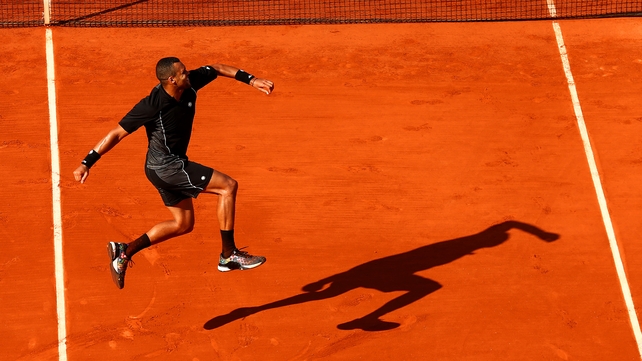 Jo-Wilfried Tsonga celebrates winning his match against Dudi Sela of Israel during day four of the French Open at Roland Garros on Wednesday