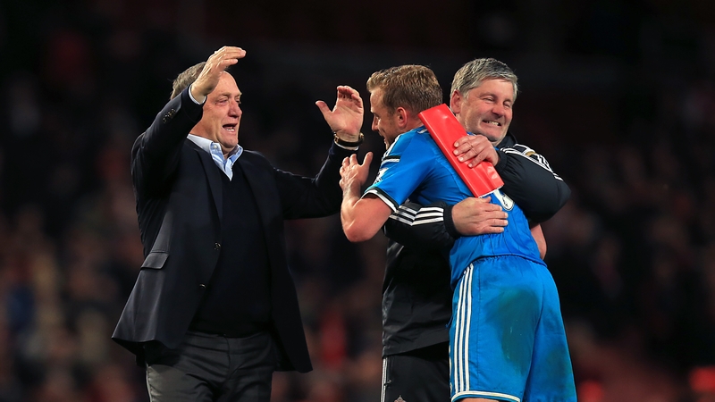 Dick Advocaat (left) and Paul Bracewell (centre) celebrate with player Lee Cattermole (right) after securing Premier League survival