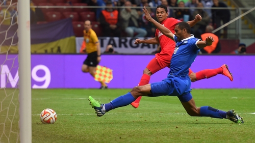 Carlos Bacca of Sevilla scores his team's second goal