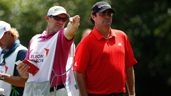 Steven Bowditch confers with caddie Neil Wallace on the 15th
