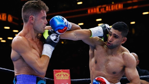 Amir Khan (R) in action against Chris Algieri