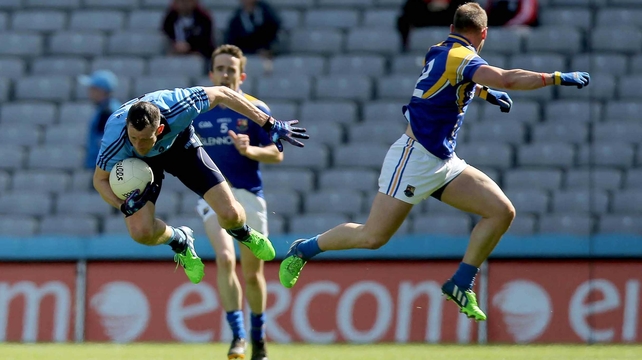 Denis Bastick of Dublin and Longford's Peter Foy take different directions in the Leinster SFC at Croke Park, Dublin