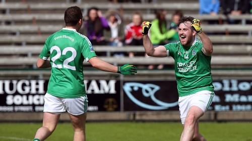 Sean quigley (r) celebrates scoring from the penalty spot