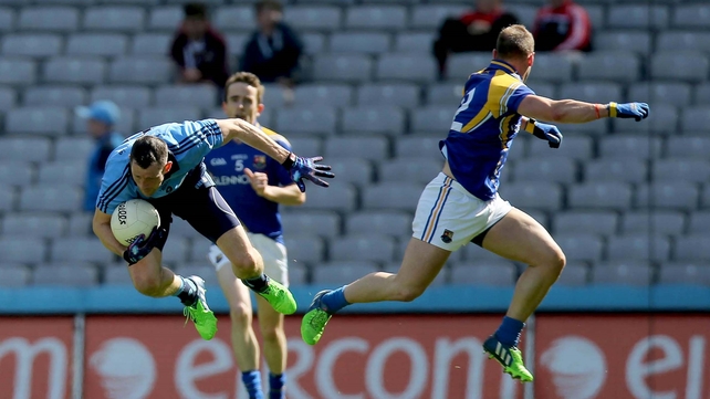 Denis Bastick of Dublin with Peter Foy of Longford (r) in action during what was a one-sided encounter