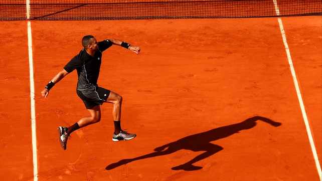 Jo-Wilfried Tsonga celebrates winning his match against Dudi Sela during day four of the French Open at Roland Garros