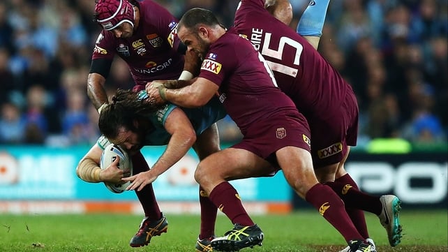 Aaron Woods of the Blues is up-ended during game one of the State of Origin series between New South Wales and the Queensland Maroons at ANZ Stadium in Sydney