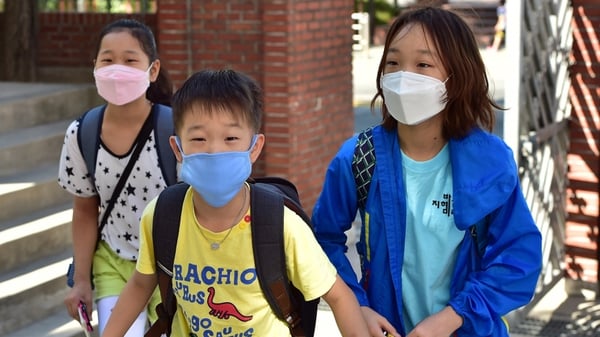 Children wear face masks to protect against possible MERS virus at a school in Seoul