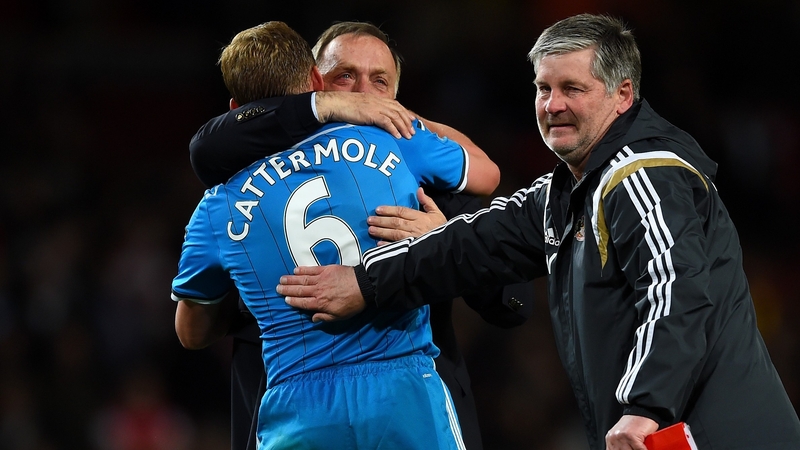 Dick Advocaat gets a hug from Lee Cattermole after the club avoided relegation